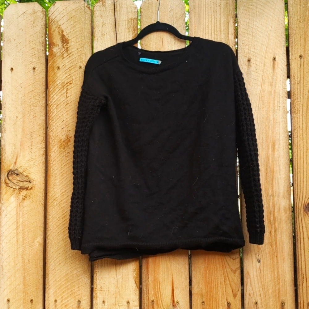 Black wool sweater with textured sleeves